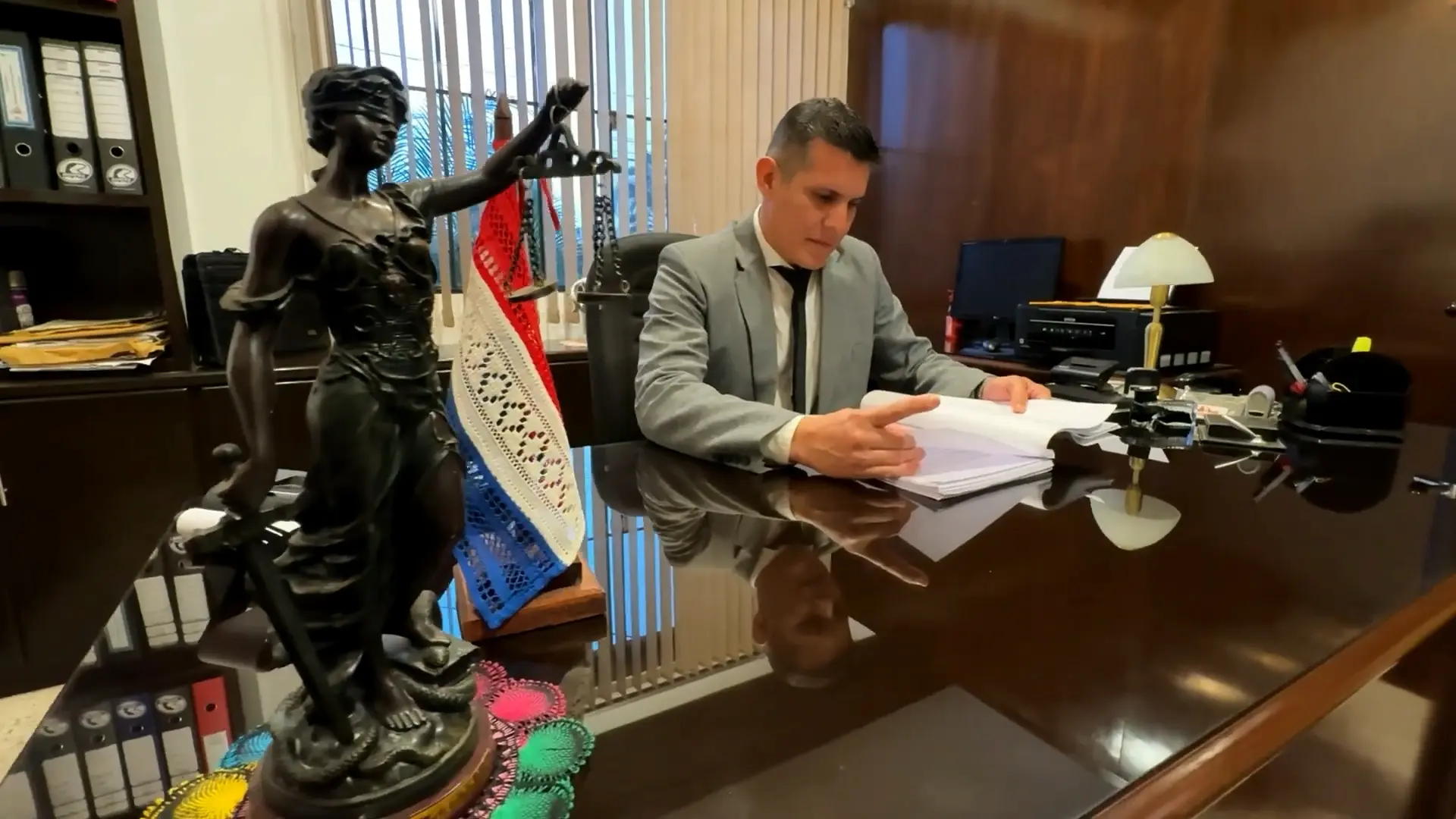 Misinformation: Reljuv's lawyer reviewing files in his office.
